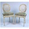 Image 1 : A PAIR OF LOUIS XVI STYLE PAINTED AND PARCEL-GILT CANED SIDE CHAIRS