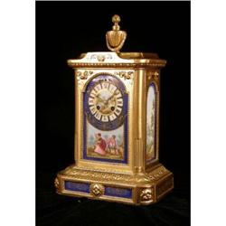 A LOUIS XVI STYLE PORCELAIN AND GILT-METAL TABLE CLOCK