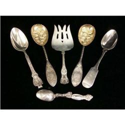 A GROUP OF SIX SILVER SERVING FLATWARE PIECES