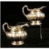 Image 1 : A PAIR OF GARRARD`S LONDON ENGLISH VERMEIL LINED STERLING SILVER FOOTED CREAM JUGS