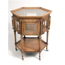 A VICTORIAN STYLE CARVED WALNUT OCTAGONAL TEA TABLE