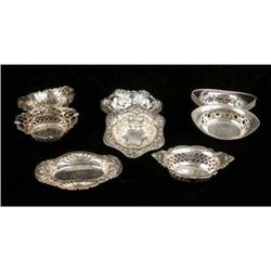 A GROUP OF STERLING SILVER NUT DISHES