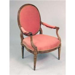 A LOUIS XVI PROVINCIAL CARVED WALNUT FAUTEUIL