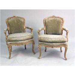 A PAIR OF LOUIS XV STYLE CARVED GILTWOOD FAUTEUILS