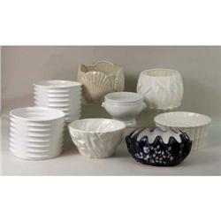 A GROUP OF CERAMIC FLOWER CONTAINERS