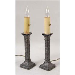 A PAIR OF REPOUSSE SILVERED-METAL CANDLESTICK-FORM DRESSING TABLE LAMPS