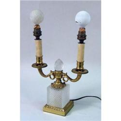 A LOUIS XVI STYLE CUT-GLASS AND GILT-METAL TWO-BRANCH CANDLESTICK-FORM LAMP