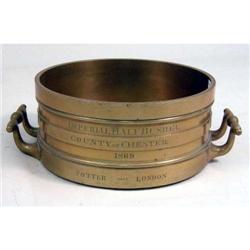 A BRASS HALF-BUSHEL MEASURE