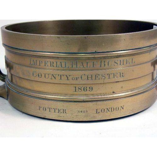 A BRASS HALFBUSHEL MEASURE