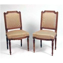 A PAIR OF LOUIS XVI STYLE CARVED WALNUT SIDE CHAIRS