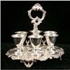 Image 1 : A D & S ROCOCO SILVER ON COPPER HANDLED FOOTED SHAPED OVAL EGG CUP STAND