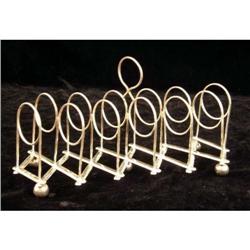 AN ENGLISH SILVER EXPANDABLE TOASTRACK