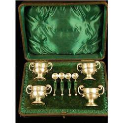 A BOXED SET OF ENGLISH STERLING SILVER FOUR SALTS WITH COLORLESS GLASS LINERS AND SALT SPOONS