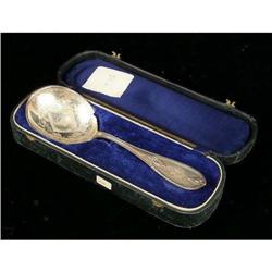 AN AMERICAN COIN SILVER SEERVING SPOON IN PRESENTATION CASE