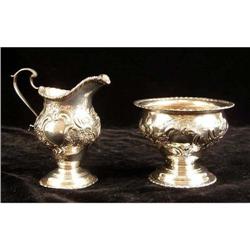 AN ENGLISH SILVER FOOTED OPEN SUGAR BOWL AND CREAM JUG SET