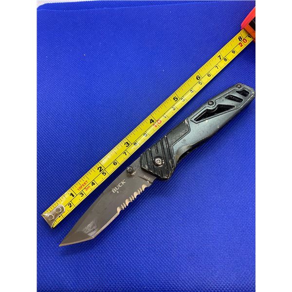 Buck folding pocket knife with clip.