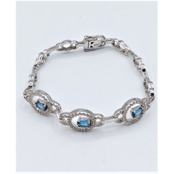 STERLING SILVER BRACELET W/ BLUE TOPAZ AND CZ W/ APPRAISAL $1270