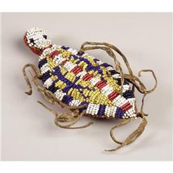 A SIOUX BEADED HIDE FETISH c. 18