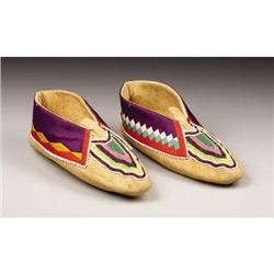 A PAIR OF DELAWARE BEADED HIDE MOCCASINS c. 19