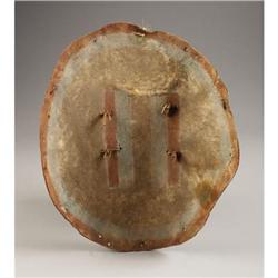 A PUEBLO PAINTED HIDE DANCE SHIELD c. 18