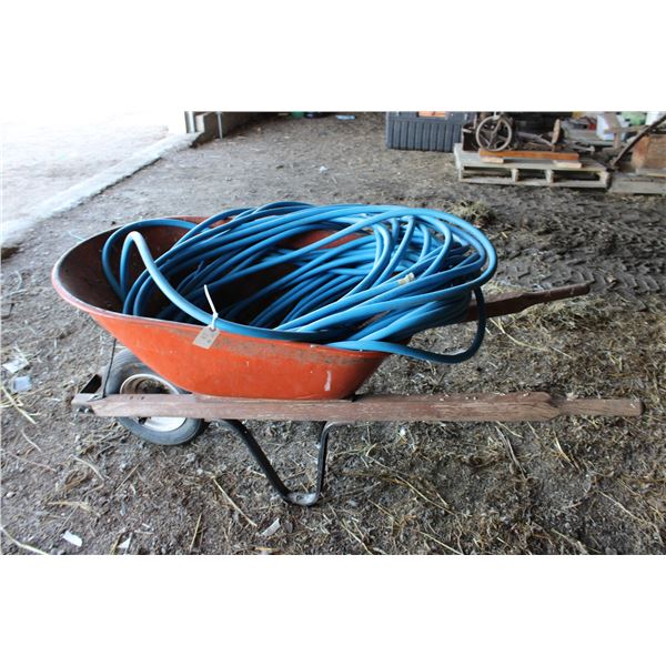 Wheelbarrow with garden hose