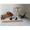 Image 1 : Metal & granite demolition trophy, wood car, military cargo plane, police car (moving parts).