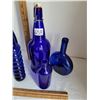 Image 2 : Group of cobalt blue bottles, assorted styles and sizes.