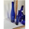Image 3 : Group of cobalt blue bottles, assorted styles and sizes.