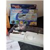 Image 2 : As seen on TV Handy Stitch, the hand held sewing machine plus a sewing case for accessories.