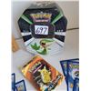 Image 3 : Pokemon collector tin, complete pack of Picachu evolution cards & plush Eevee with moving head.