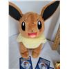 Image 4 : Pokemon collector tin, complete pack of Picachu evolution cards & plush Eevee with moving head.