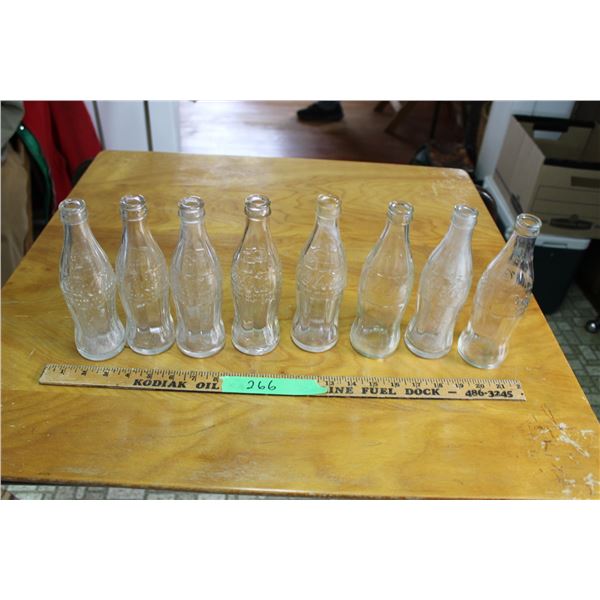 (2X THE MONEY) 8 Clear Coca Cola Bottles Stamped Different Years