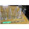 Image 3 : (2X THE MONEY) 8 Clear Coca Cola Bottles Stamped Different Years