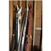 Image 1 : Lot of 4 Pairs of Skis with Rack of Ski Pol 4 Pairs of Poles