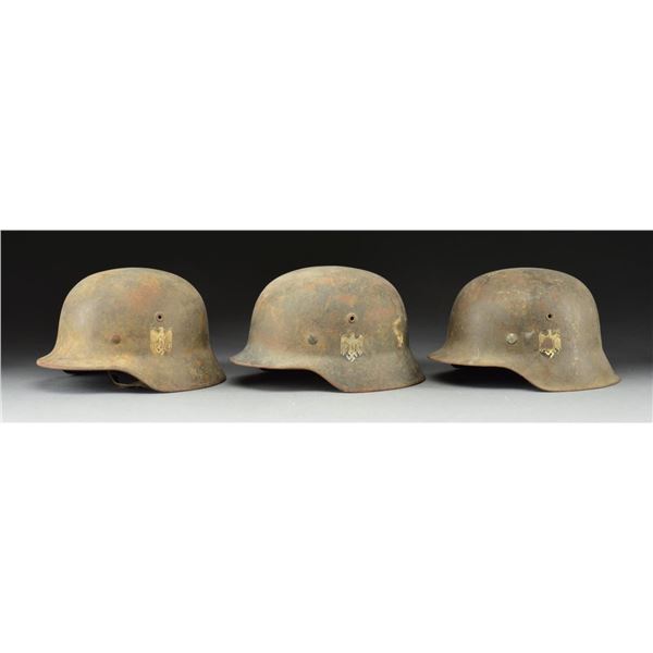 3 WWII HELMETS.