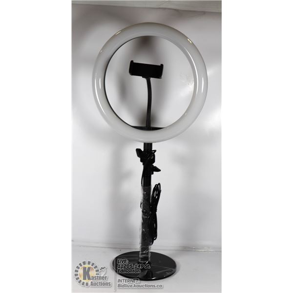 RING LIGHT ON STAND WITH PHONE HOLDER.