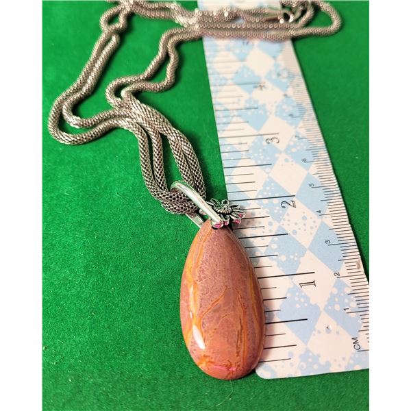 21)  NATURAL VEINED CALCITE PENDANT