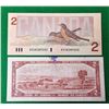 Image 2 : 7)  LOT OF 2 CANADIAN $2.00 BANKNOTES,