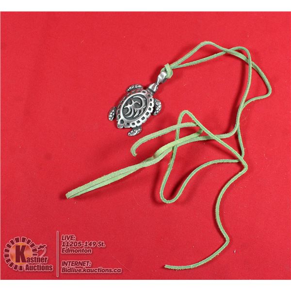 TURTLE ON GREEN LEATHER