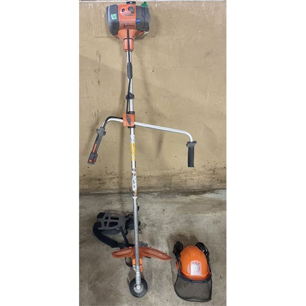 HUSQVARNA MODEL 335R GAS TRIMMER W/SAFETY HELMET, CARRY STRAP, BLADE ATTACHMENT & MANUAL. 