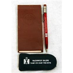 I.H. notepad, mechanical pencil, knife stone