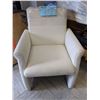Image 1 : White leather accent chair from the popular sci-fi tv series