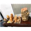 Image 1 : Group of candles on wood planks & one large candle melted from the popular sci-fi tv series