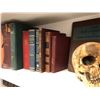 Image 2 : Shelf full of assorted hardcover books & prop skull  from the popular sci-fi tv series