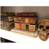 Image 2 : Shelf full of assorted hardcover books & prop skull from the popular sci-fi tv series