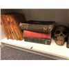 Image 2 : Shelf full of assorted hardcover books & prop skull from the popular sci-fi tv series