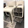 Image 2 : Set of 5 white leather & chrome bar stools from the popular sci-fi tv series