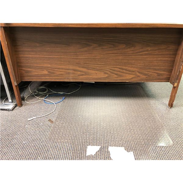 5 drawer brown wooden office desk from production offices from the show