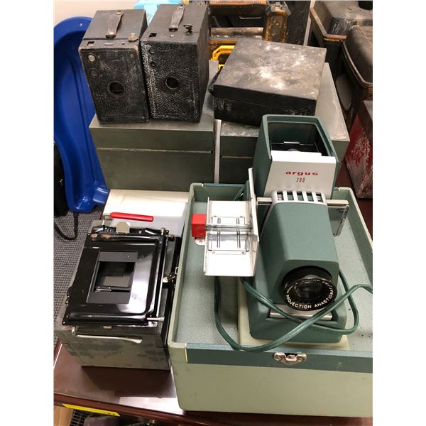 Slide projector/2 vintage box cameras/ metal storage containers/etc. from popular sci-fi series