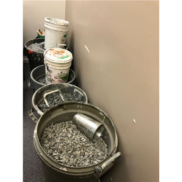 Group of 5 garbage cans filled with concrete rubble particles and debris plus 2 buckets of painted